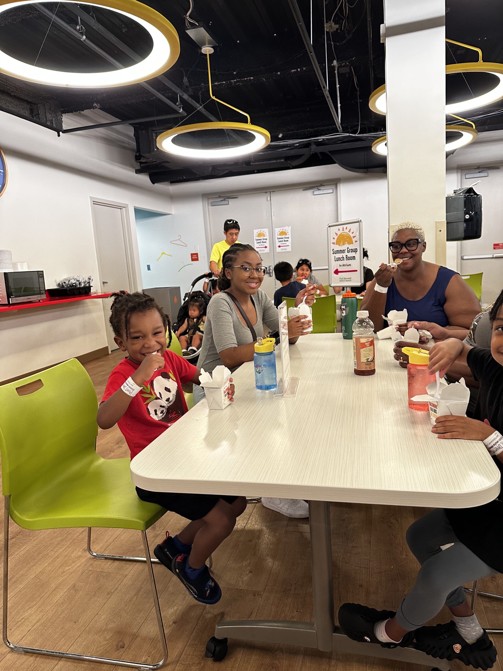 group of adults and children eating ice cream