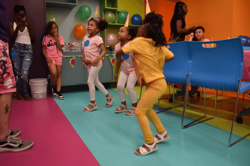 girls dance at a birthday party at Port Discovery Children's Museum